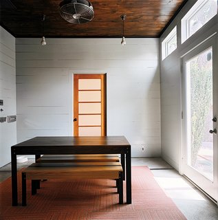 Salvage Love - Photo 9 of 10 - Dollahite kept most rooms spare, allowing each piece of furniture and art to have a presence. In the dining room, the table is its own centerpiece.