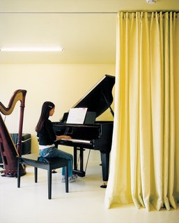 Musical accompaniment to daily life is provided by the children, both of whom play the grand piano.