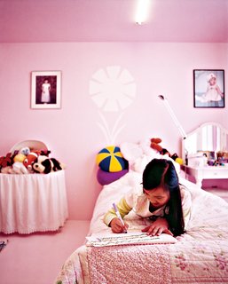 Inside, the space is spare but infused with color because "painting is the cheapest way to decorate." Twelve-year-old Tabitha's room is pink.