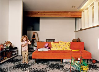 Maple performs in the basement playroom. The basement windows are coated with a polycarbonate greenhouse glaze.