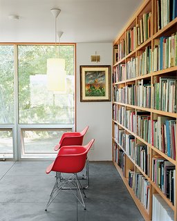 Abiquiu Debut - Photo 4 of 10 - Up above the sitting room a duo of Eames shell chairs and a bank of luminous operable windows await a pair of weary readers.