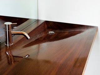 A high-gloss iroko-wood sink in the sleeping cabin's bathroom, designed by architecture students at the University of Toronto.