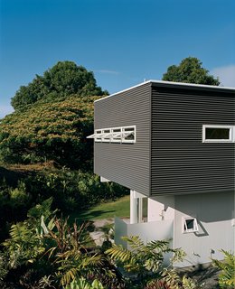 Corrugated siding usually used for roofing is used for the exterior.