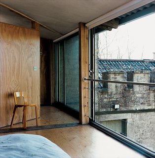 In the master bedroom, an original Aalto L leg chair from 1953 offers an idyllic spot to tie shoes.
