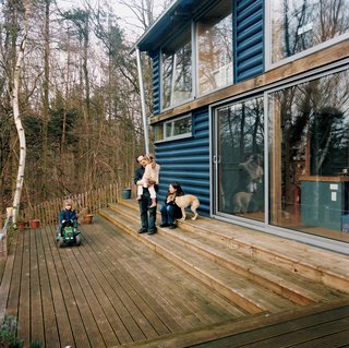 The addition includes a large timber deck at the front, where the family can lounge and enjoy the lush scenery.