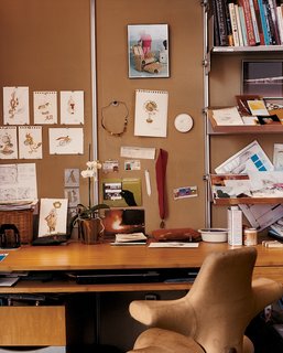 The office is aligned against one wall of the great room, behind a three-panel system of fiberglass-and-bamboo shoji screens that can be variously arranged according to the occasion and the degree of disarray.