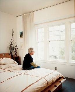 David Baker sits on the Plyboo bed of his own design; it was fabricated by Julianna Sassaman.