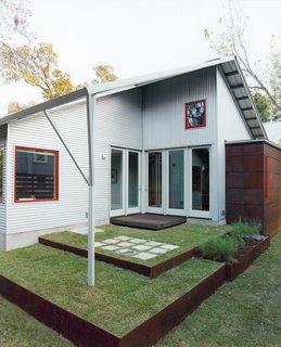 A back patio, designed by Allison’s sister, Jennifer Orr, a landscape architect, opens to the living room and to the office.