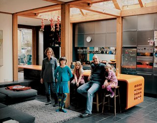 Londoner Marcus Lee turned a narrow lot next to a pickle works into a high-flying wood retreat with a garden out back and plenty of soaring space upstairs.