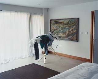 The bedroom is minimally furnished with a Skipper bed from Habitat, and occasionally, a pile of unironed laundry.