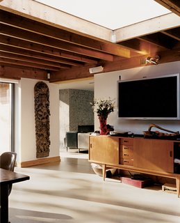 An expansive skylight gives a feeling of spaciousness to the kitchen/dining area.