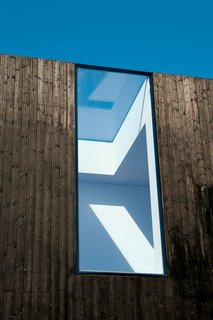Adjaye cut a gap straight through the roof and facade.