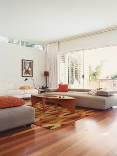 Minimalist Bachelor Pad in Brisbane - Photo 2 of 8 - The low-slung Strata sofa by King Furniture is perfect for "sleeping."