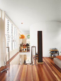 Minimalist Bachelor Pad in Brisbane - Photo 6 of 8 - The black column in his living room is not a mysterious monolith, but one of his speakers.