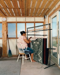Rosie Joe weaves a traditional Navajo rug.