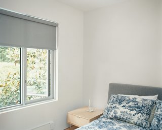 The guest room is furnished with pieces by neighbor and designer Niels Bendtsen.
