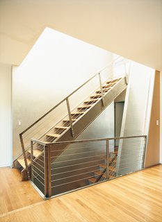 Home Schooled - Photo 5 of 9 - What was once a closed-in staircase has been opened up, allowing light to pour in.