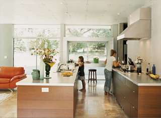 Home Schooled - Photo 9 of 9 - Muriel samples some of Haley’s culinary offerings in the new kitchen. The deep window doubles as an eating area and a place to serve guests.