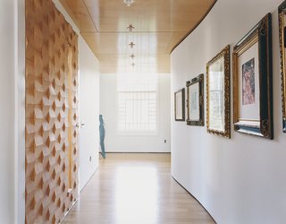 The house is as much a work of art as a showcase for it. The Suarezes are catholic in their tastes: They buy for love not investment, their collection a mix of high and low. In the foyer, prints and drawings acquired over the course of their world travels hang along the attenuated S-curve of the wall opposite the front door.