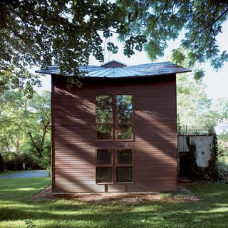 This House Tells the Time With an Oculus - Photo 2 of 6 - Before construction began, the site was surveyed to align the house precisely north to south along the solar axis and to ensure that the roof angle would parallel the angle of the sun at winter solstice.