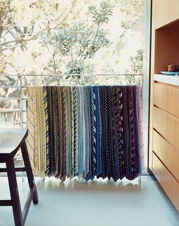 The collection of neck-ties Lloyd-Butler and Zelen have amassed is on permanent display draped over an upstairs railing.