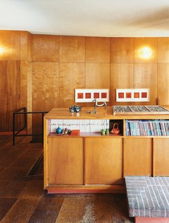 Tidy shelving provides perfect storage for Phaidon’s Art and Ideas series. Joseph Albers prints hang in the background.