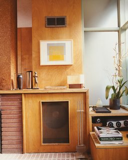 Hill included a hidden turntable and mono speaker cabinet in the original design.
