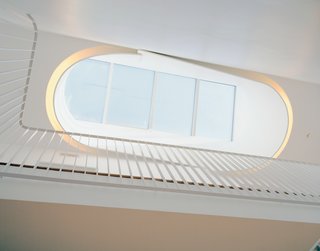Briggs and Knowles based their design of the oculus on traditional Victorian skylights but tweaked it to fit a more modern sensibility and outfitted it with fluorescent tubing to recreate the effect in the evening.