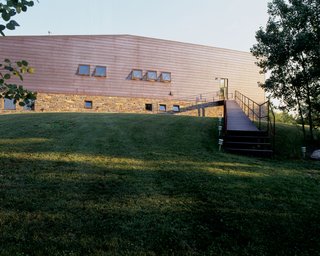 The long entry ramp leads into the large living, dining and kitchen space.