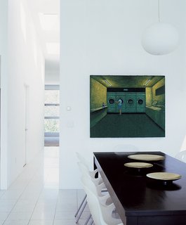 O chairs by Karim Rashid surround the dining table.