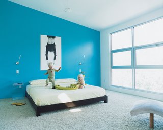 Sebastien and Adrienne find new uses for their parents' bed by West Elm.