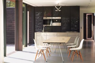 Chalkboard-fronted cabinets provide an ideal surface for scrawling shopping lists.