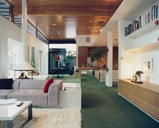 WestEnders - Photo 7 of 8 - In lieu of a checkerboard effect, Kovel kept his carpet squares all vibrantly verdant. With the bamboo cabinets and countertops the whole space has a pastoral feel. "I wanted it to be like the Bradys’ backyard," he says.