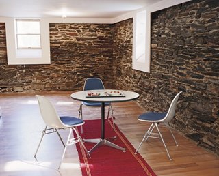 Four Houses and a Future - Photo 5 of 11 - Schenk discovered native flagstone in the basement of Large when they tore away the old wood wall lining, and fell in love with its rough and cool exterior.