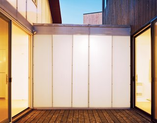 Four Houses and a Future - Photo 10 of 11 - A translucent Polygal corridor separates Small and Medium.