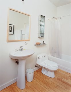 Baton Rouge Oasis - Photo 10 of 13 - The family opted for modest—and cheap—design choices in the kitchen and bathroom (above), which are commonly the most money-sucking rooms in a home.