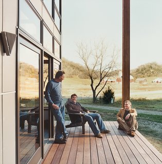 Bill Weber and sons Nick and Wyatt (left) relax on the home’s deck.