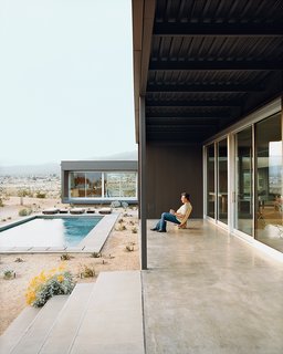 Groupings of succulents accent the home’s entry path and pool area.