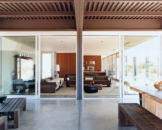 There are generously proportioned nine-foot-high ceilings throughout the Desert House. Marmol Radziner designed and built the outdoor table and benches from reclaimed Douglas fir.