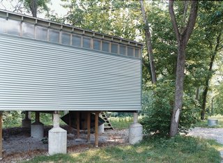 The creekside Fish Camp prototype rests on oversize flood-rated pylons, one of many foundation options the Camp units can accommodate.