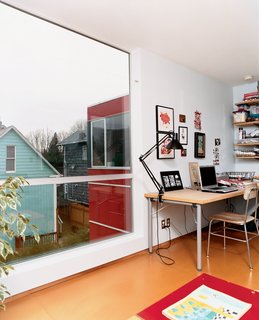 Sarti’s upstairs office provides a cozy corner for work and relaxation. The large windows allow him to search the surrounding backyards for inspiration when stuck in a rut.