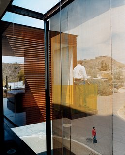 Xeros Effect - Photo 7 of 7 - The woven wire steel mesh used to cloak Xeros’s east façade stands in stark contrast to Phoenix’s blue sky and the palo brea planted along the street.