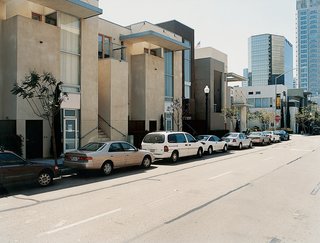 The Jonathan - Photo 2 of 10 - Architect and developer Jonathan Segal's "convertible units" are one-bedroom rental apartments with hydraulic lifts in their single-car garages, which allow two cars to be parked in one space.