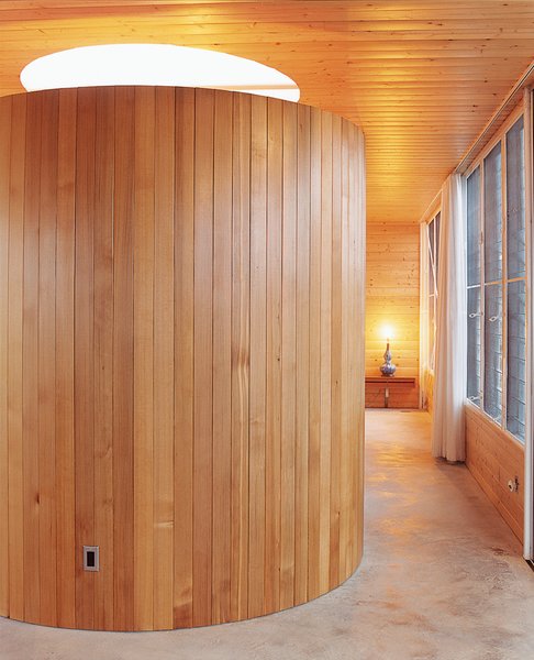Go With the Flow - Photo 7 of 11 - The tub room sits at the end of the hallway leading to the bedroom, and serves as a visual centerpiece from almost every area of the home. The steel frame bisects the opening for the six-foot-wide skylight.