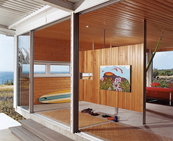 Go With the Flow - Photo 10 of 11 - A small room divider offers a place to hang Cathy’s painting Pelevision, which was inspired by her first trip to the island.
