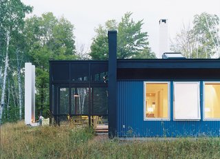 A side view of the house and of Salmela’s signature architectural feature: the "unchimney." All windows are from Loewen.