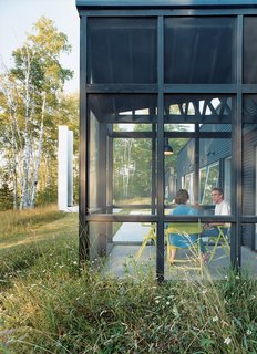 "Every room except the bath has huge windows." explains Bruce Golob. "And although David was reluctant to design a screen porch he figured out a way to do it without interfering with any of the views."