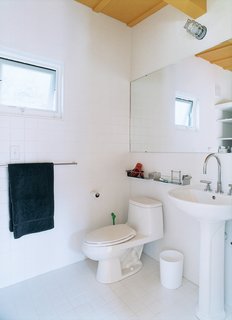 Both bathrooms are simple and basic, with Dornbracht fixtures as the only real extravagance.