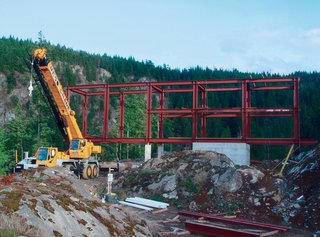 The design of the Cantilever House, as it's known, is based on a 14-by-86-by-22-foot steel frame resting on a 14-by-31-foot concrete foundation bolted to an existing rock.