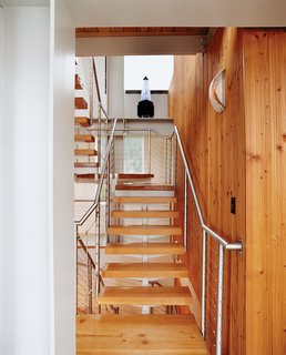 The stairs and the wood paneling were designed and built by wood-worker Noah Israel, a longtime neighbor and friend.